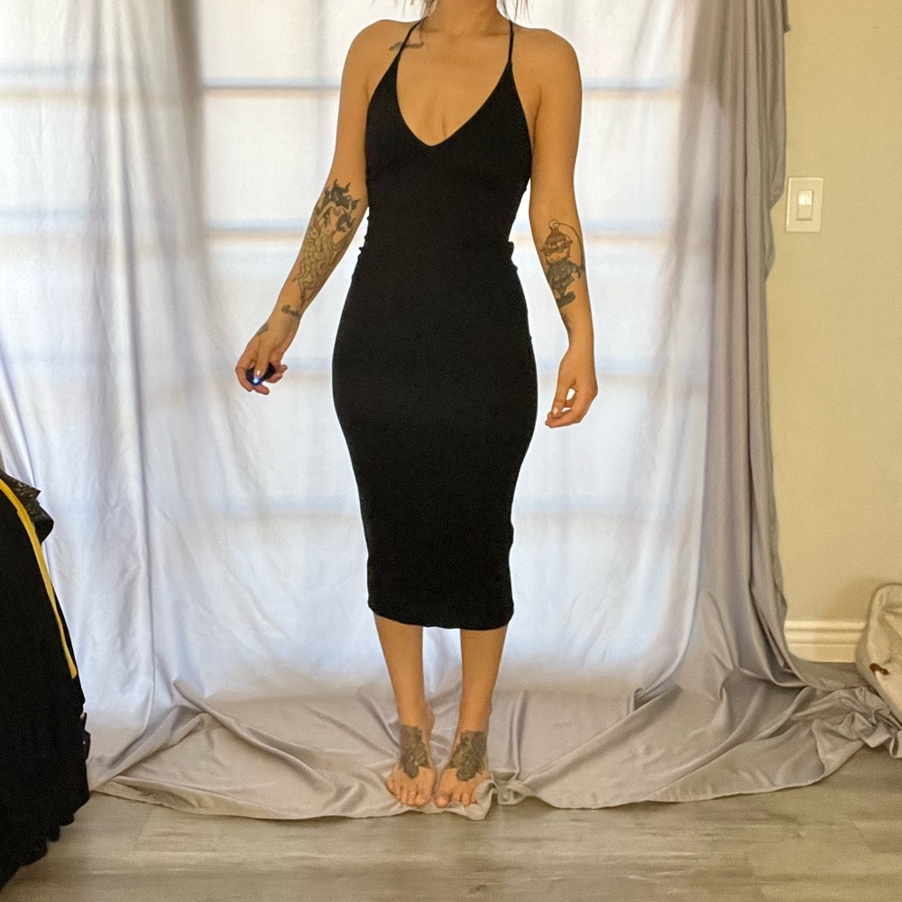 Black. Small. Forever 21- Contemporary. Midi dress. Fun back detail.